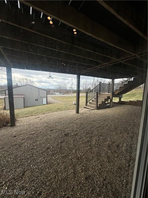 view of yard featuring an outbuilding and an outdoor structure