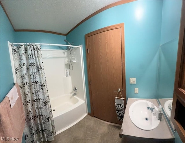 full bath featuring vanity, tile patterned flooring, shower / bath combination with curtain, a textured ceiling, and crown molding