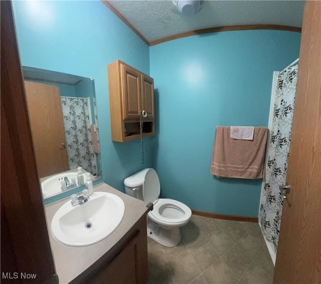 bathroom featuring toilet, ornamental molding, a textured ceiling, vanity, and baseboards