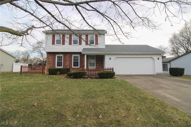 view of front of house with a garage, driveway, brick siding, fence, and a front yard