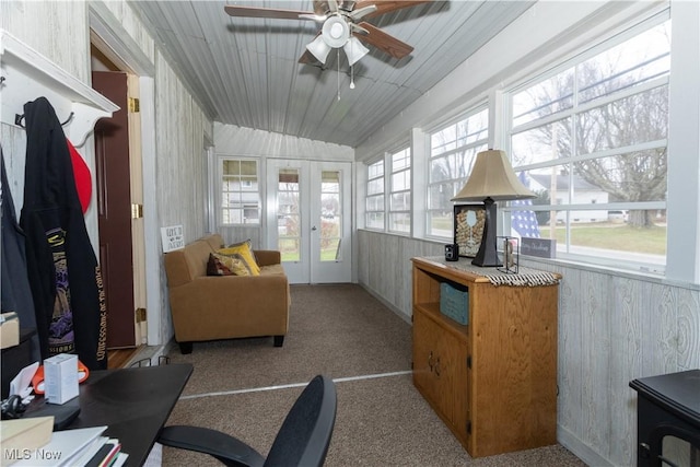 sunroom with wood ceiling, a ceiling fan, and french doors