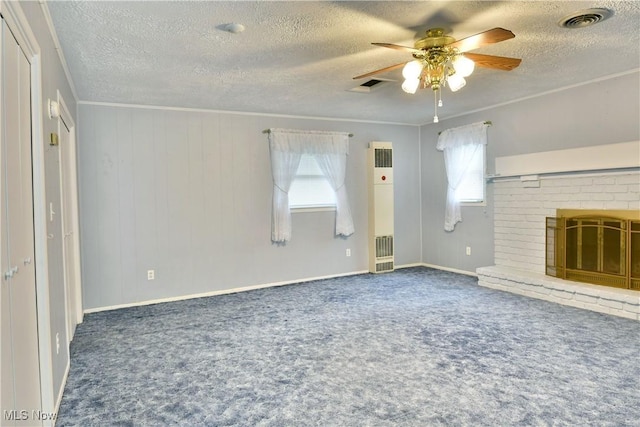 unfurnished living room featuring ornamental molding, carpet, visible vents, and a fireplace