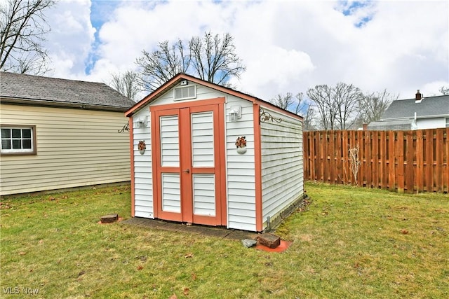 view of shed with fence