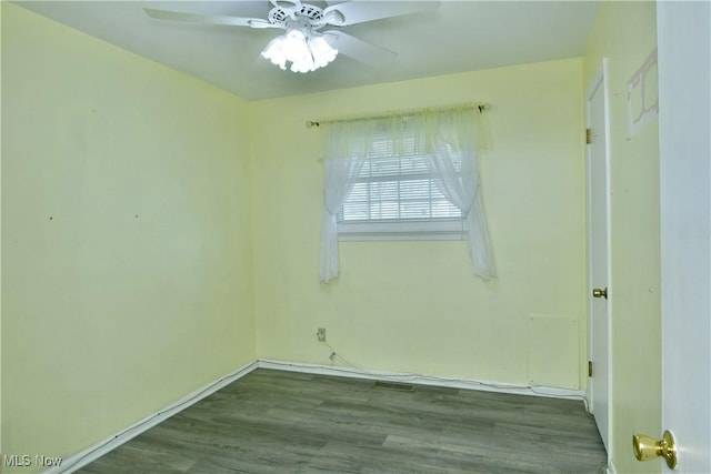 empty room with ceiling fan and wood finished floors