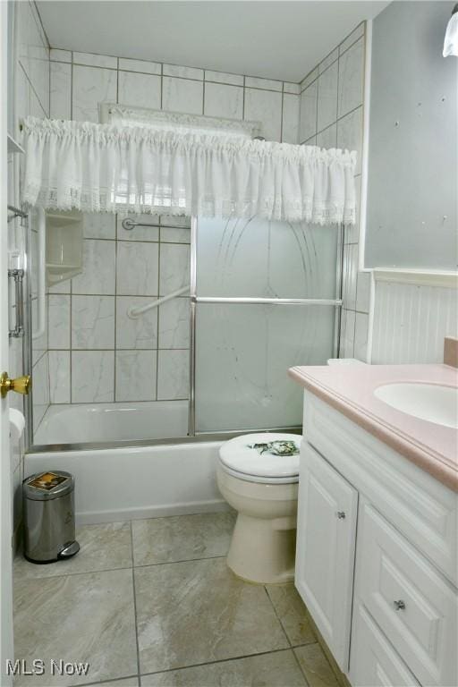 full bath featuring shower / bath combination, vanity, toilet, and tile patterned floors