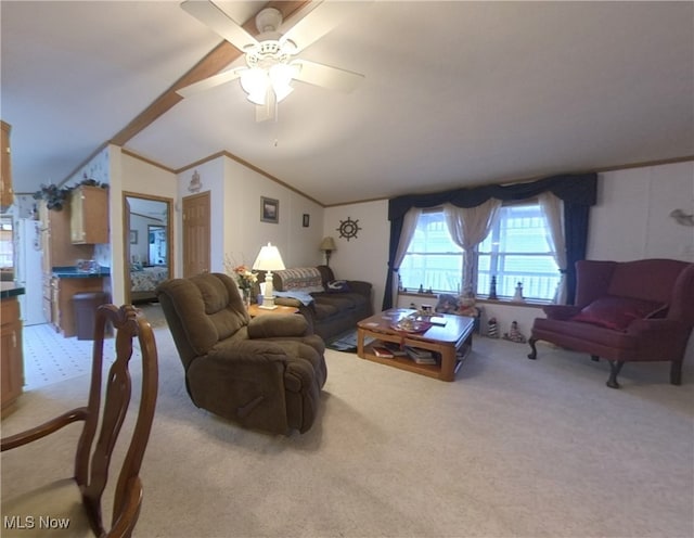 living room with a ceiling fan, vaulted ceiling, crown molding, and light colored carpet