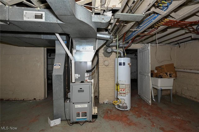 utilities with water heater, visible vents, and heating unit