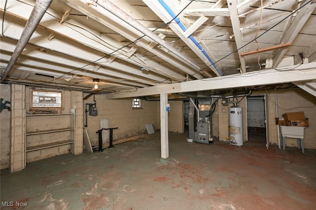 basement with water heater and heating unit