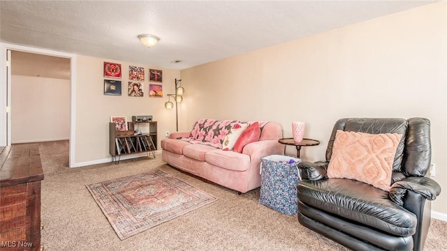 carpeted living area featuring baseboards