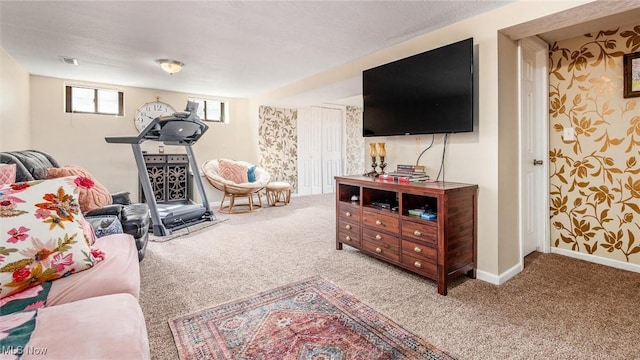 living room featuring carpet flooring, visible vents, and baseboards