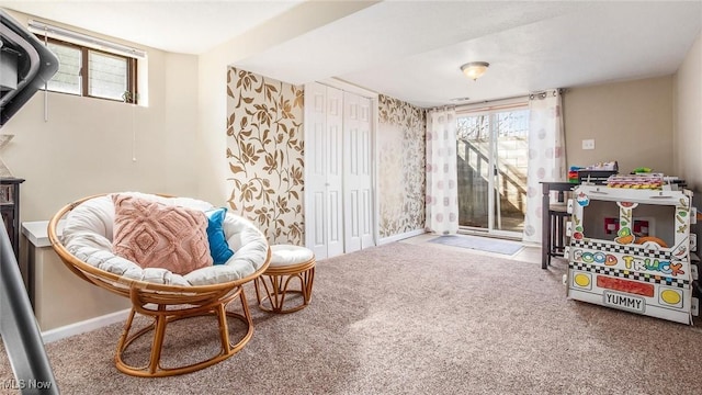 sitting room with carpet and baseboards