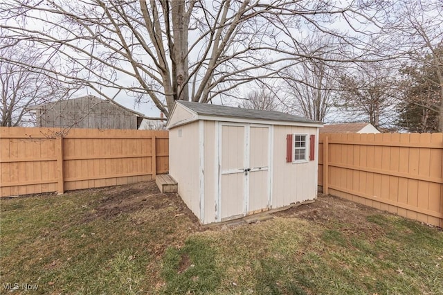 view of shed featuring a fenced backyard