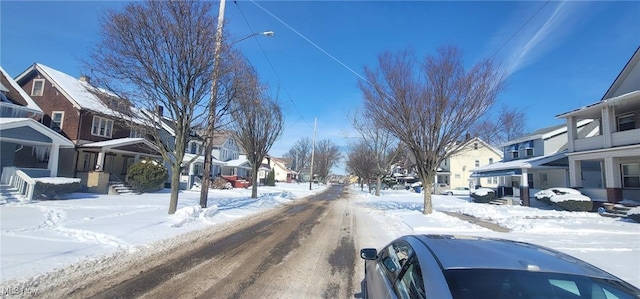 view of road featuring a residential view and street lights