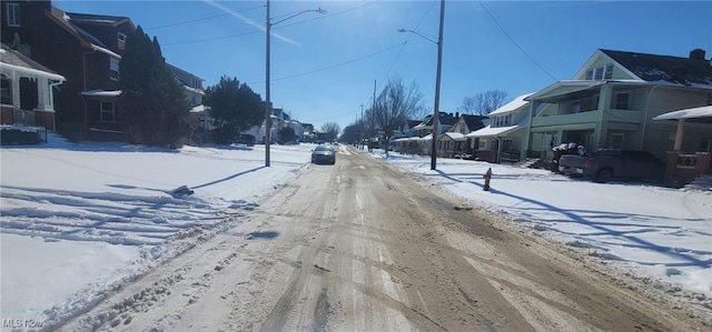 view of street with street lights and a residential view