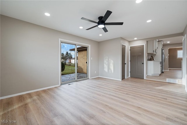 unfurnished living room with recessed lighting, visible vents, light wood-style flooring, a ceiling fan, and baseboards