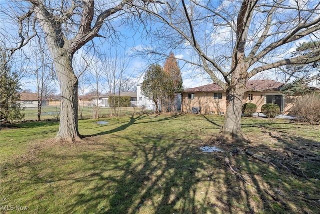 view of yard with fence