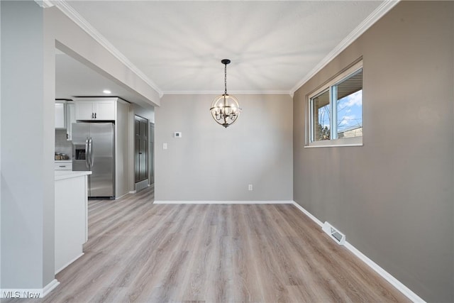 unfurnished dining area with light wood-style flooring, baseboards, a chandelier, and ornamental molding