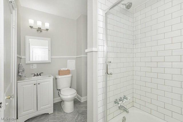 full bath with baseboards, shower / bathing tub combination, vanity, and toilet