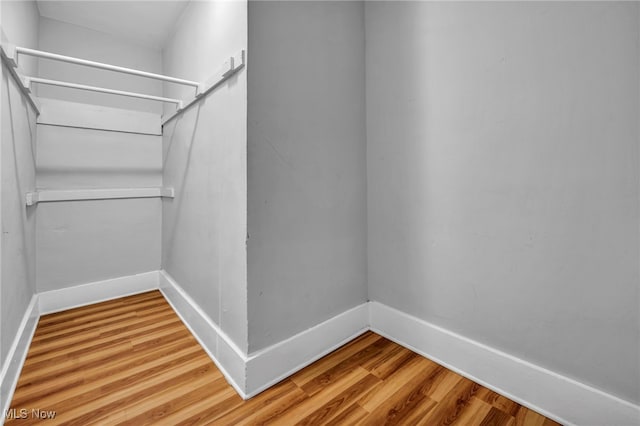 spacious closet with wood finished floors