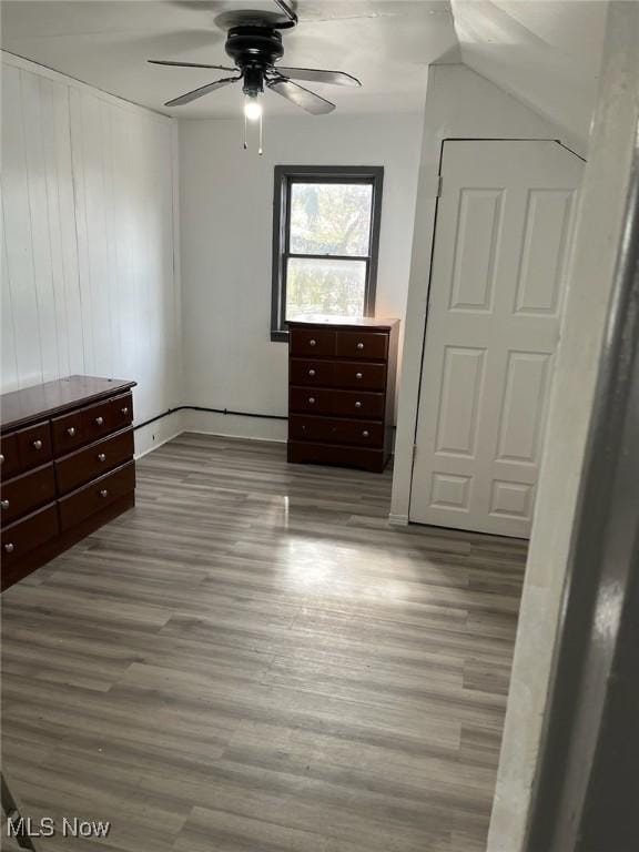 unfurnished bedroom with ceiling fan and wood finished floors