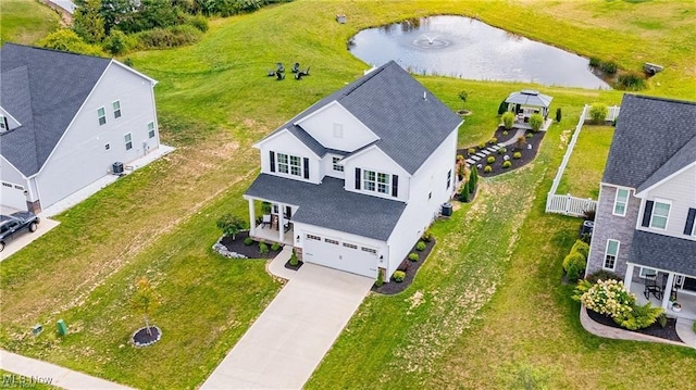 birds eye view of property with a water view