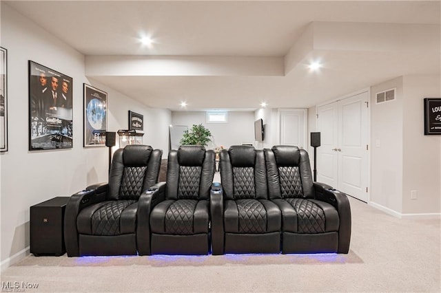 carpeted home theater room featuring baseboards, visible vents, and recessed lighting