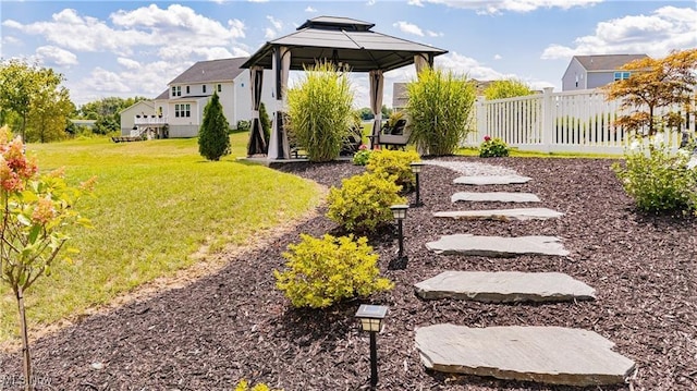 view of yard with a gazebo and fence