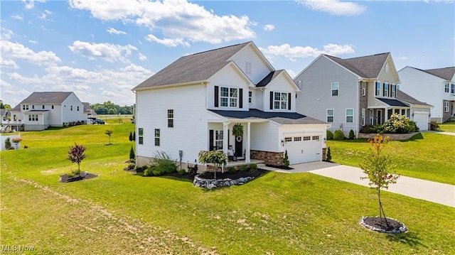 traditional-style home with an attached garage, driveway, and a front yard