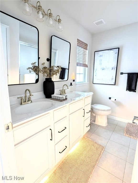 full bathroom with tile patterned flooring, visible vents, a sink, and toilet