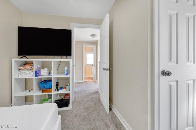 carpeted bedroom with baseboards