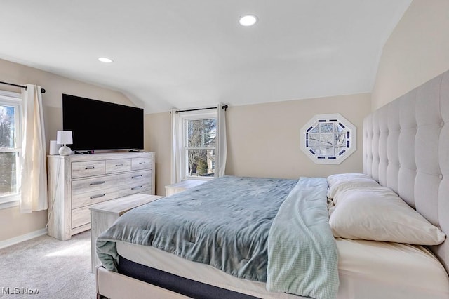 bedroom with recessed lighting, light colored carpet, vaulted ceiling, and baseboards