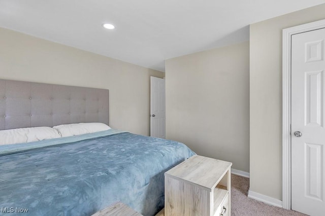 bedroom with recessed lighting, carpet flooring, and baseboards