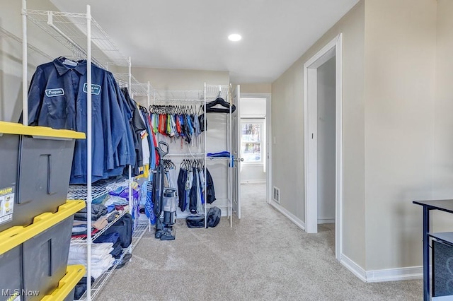 walk in closet with carpet floors and visible vents