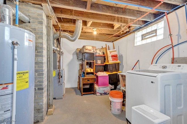 below grade area featuring gas water heater and washer / dryer