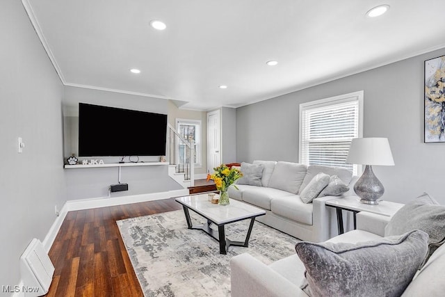 living area with recessed lighting, wood finished floors, baseboards, stairs, and ornamental molding