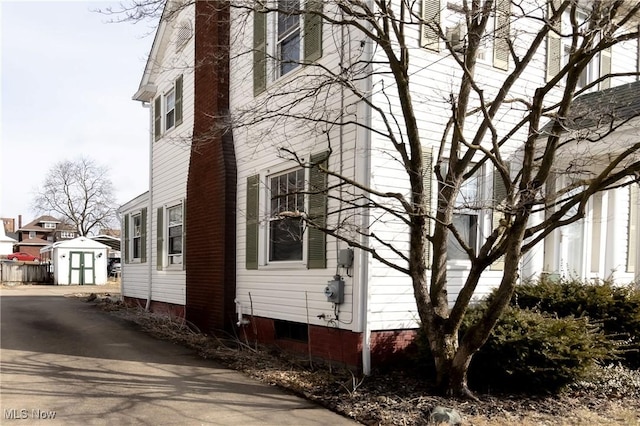 view of property exterior featuring an outbuilding