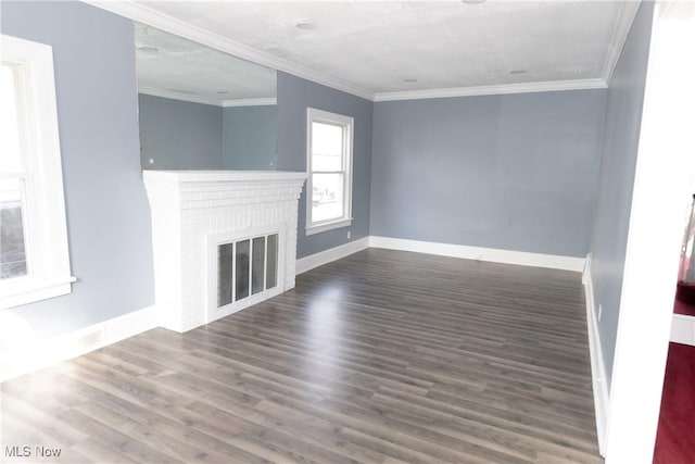 unfurnished living room featuring baseboards, a fireplace, ornamental molding, and wood finished floors