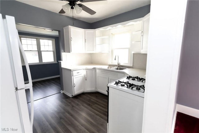 kitchen featuring open shelves, white appliances, white cabinetry, and light countertops