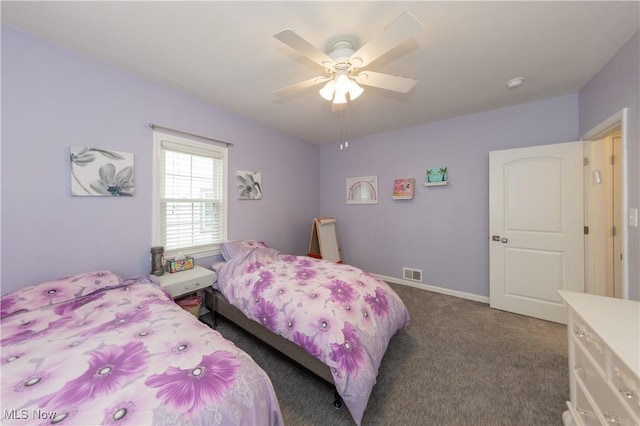 bedroom with ceiling fan, baseboards, visible vents, and dark colored carpet