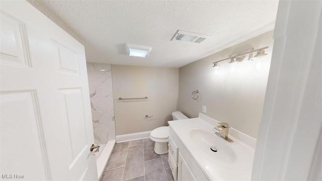 bathroom with visible vents, toilet, walk in shower, a textured ceiling, and vanity