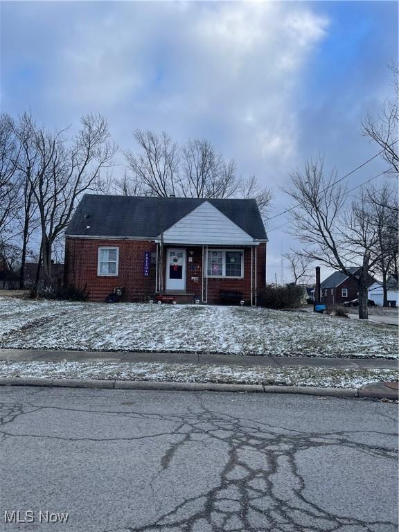 view of front of property featuring brick siding