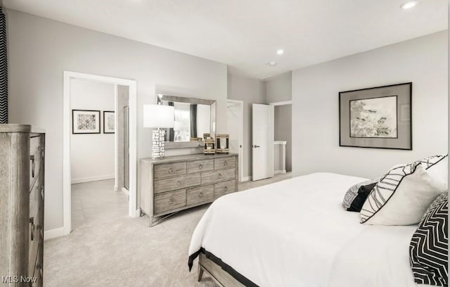 bedroom featuring light carpet, baseboards, and recessed lighting