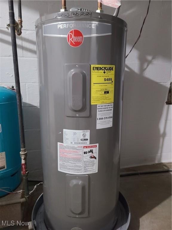 utility room featuring water heater