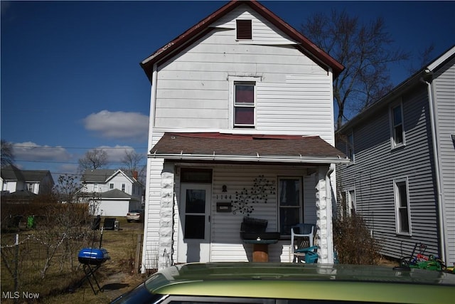 view of front of house with a porch and roof with shingles