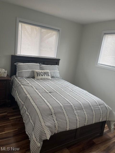 bedroom featuring wood finished floors