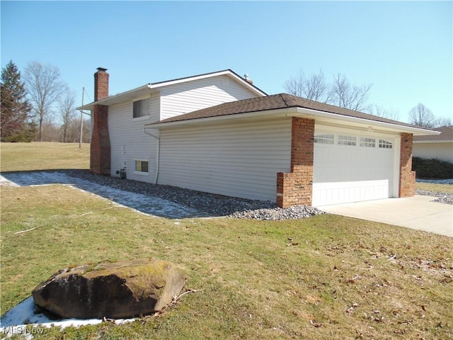 view of home's exterior featuring a garage, driveway, a chimney, and a yard