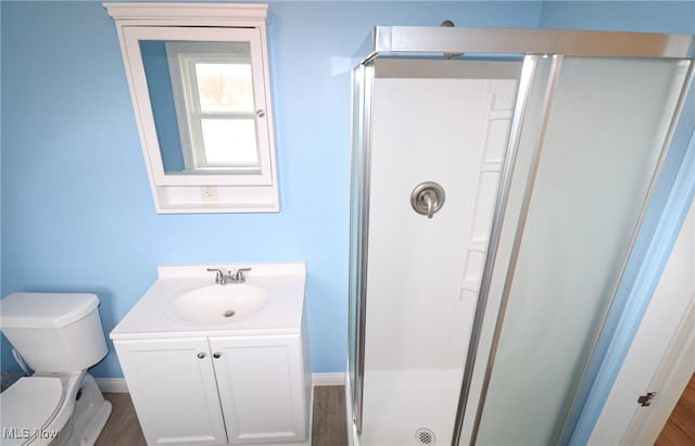 757 Eastern Rd, Doylestown, OH 44230 - full bath featuring a shower stall, wood finished floors, vanity, baseboards, and toilet