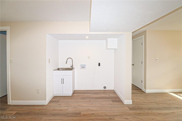 757 Eastern Rd, Doylestown, OH 44230 - washroom featuring light wood-type flooring, a sink, laundry area, and washer hookup