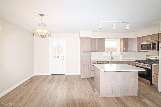 757 Eastern Rd, Doylestown, OH 44230 - kitchen with an inviting chandelier, appliances with stainless steel finishes, light countertops, and light wood-style flooring