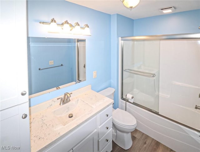 757 Eastern Rd, Doylestown, OH 44230 - bathroom with toilet, visible vents, wood finished floors, combined bath / shower with glass door, and vanity
